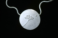 Gedenksieraden Schermbloem